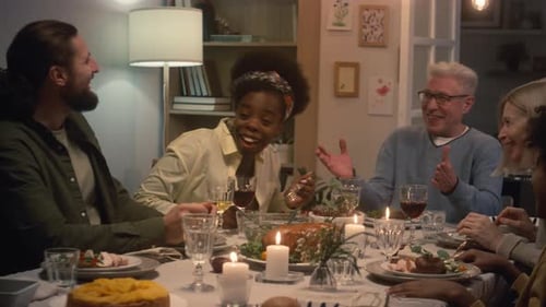 Friends and Family Gathered Around Table for Dinner