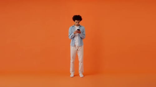 Young Adult Excited Looking at Their Phone