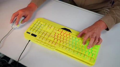Bright yellow keyboard and mouse set up for gaming
