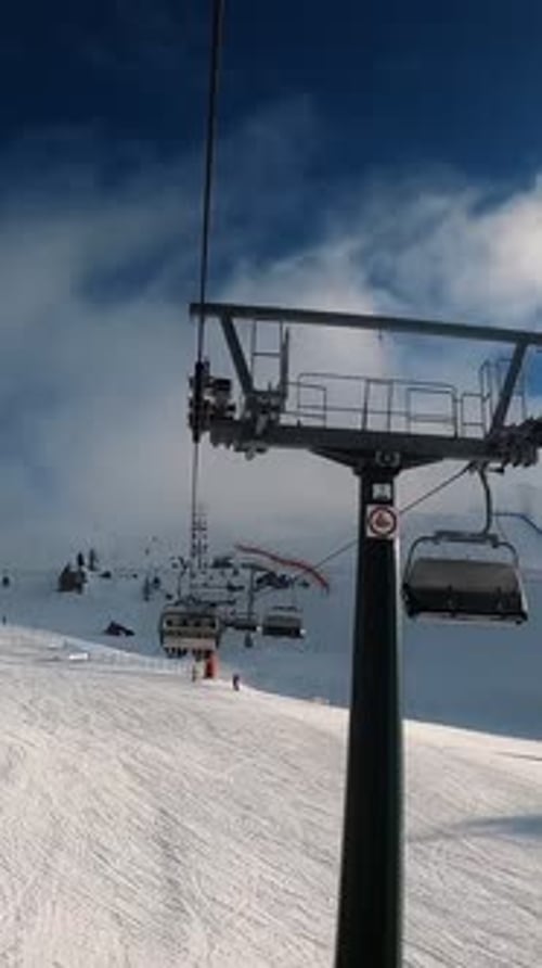 FPV POV of Cable Chair Ski Lift Ascend for Alpine Skiing in Dolomites Italy