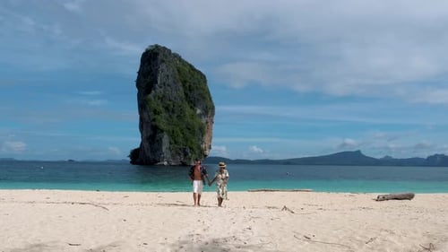 Koh Poda Krabi Thailand Asian Woman and European Men Walking on the Tropical Beach of Koh Poda