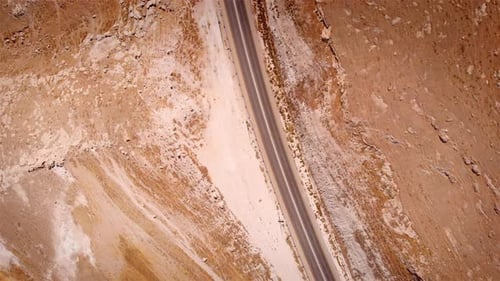 Car parking on side Road in the desert aerial Flight top down view