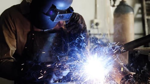 Welder welding a metal