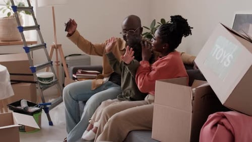 Happy Family Taking Selfie in New Home