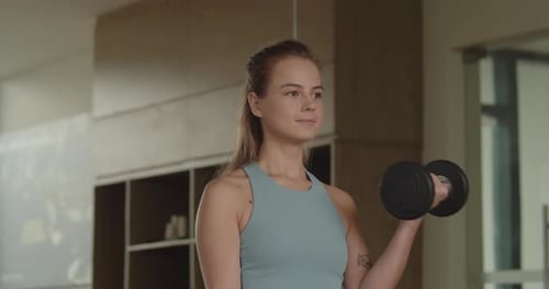 Female Hands Taking Bodybuilding Dumbbells in Gym Club Close Up Woman Hands Taking Weight Lifting in