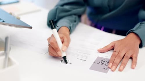 Hands, writing and cv with paper, desk or yes for choice, hiring and recruitment in hr agency