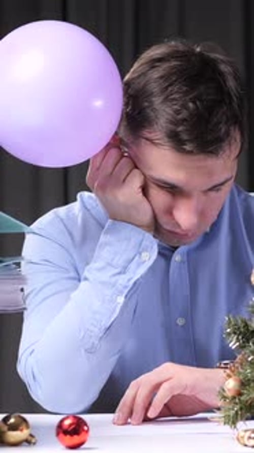 Vertical Video Office Worker Bored at Work During Christmas Time