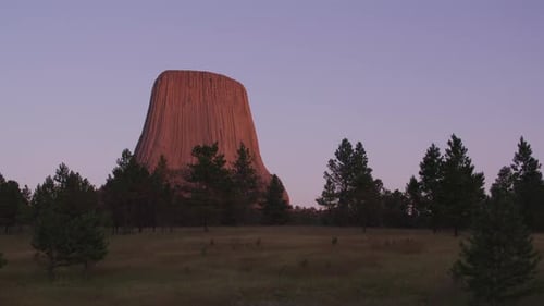 Devils tower Wyoming majestic rock formation against a summer sky in the United States