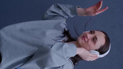 Woman Listening to Music With Headphones On