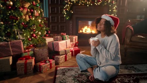 Young Woman Enjoying Christmas Morning at Home