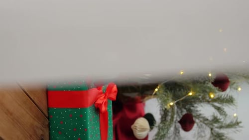 Christmas Presents and Decorations by a Fireplace