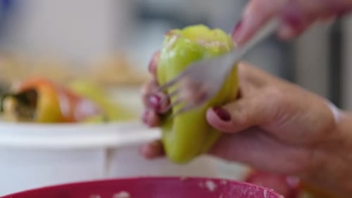 A Macro Shot of a Stuffed Pepper Being Prepared with Visible Texture of Fresh Ingredients