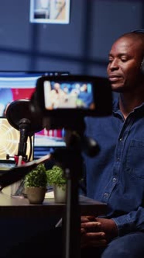 Vertical Video Man on Podcast Using Professional Equipment While Talking with Guest During Marathon