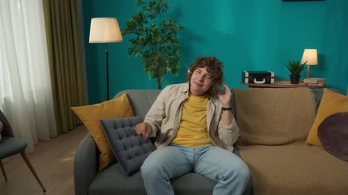 Enthusiastic Young Man Listening to Music