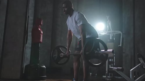 Weightlifting Workout in Dark Urban Gym