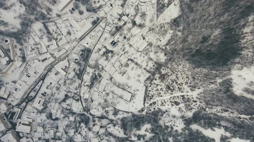Winter serenity aerial vista of a small town nestled in a snowy valley