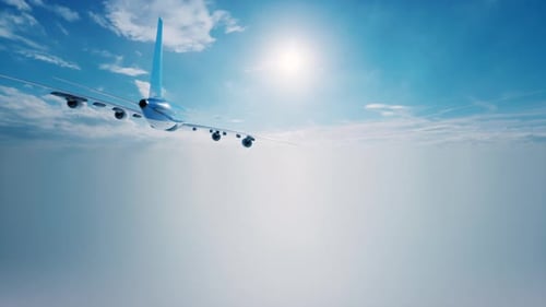 Commercial Airplane Flying High Above Clouds in Bright Blue Sky