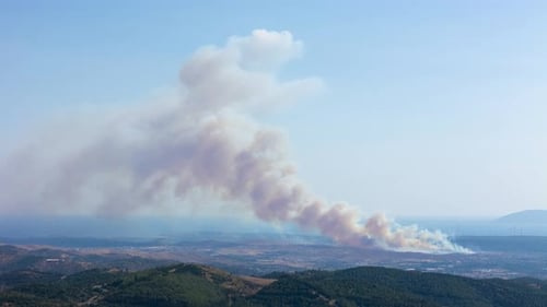 Aerial View of Wildfire Smoke Plume Over Hills