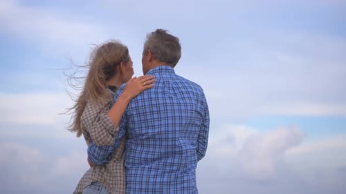 Romantic Middleaged Couple Enjoying a Peaceful Evening Together on the Beach Love Connection and