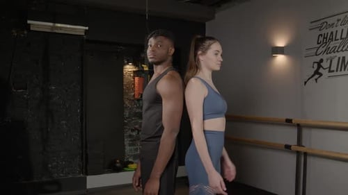 Portrait of Multiracial Male and Female Athlete Standing with Arms Crossed