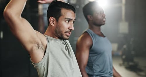Men stretching at gym together for strong body, muscle development or balance in power fitness