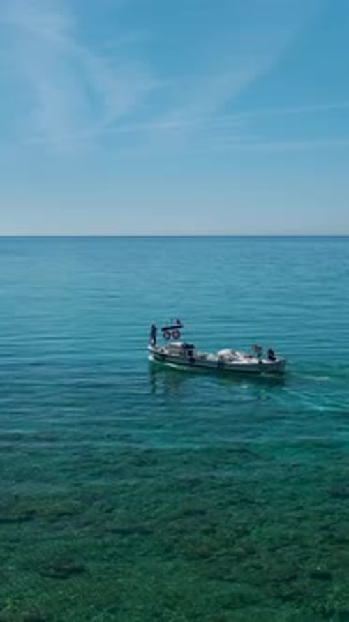 Vertical Video of Fishing Boat Crew Collecting Long Nets