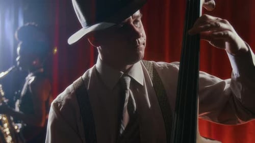 Man Playing Upright Bass Performing in Jazz Club