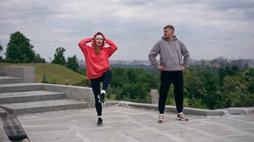 in the Park a Young Couple in Love Doing Sports Couples Warming Up Healthy Lifestyle Synchronized