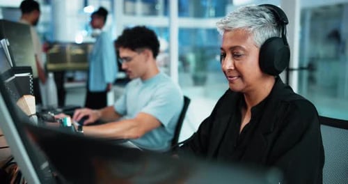 Woman, programmer and headphones with computer in office for IT, listen to music