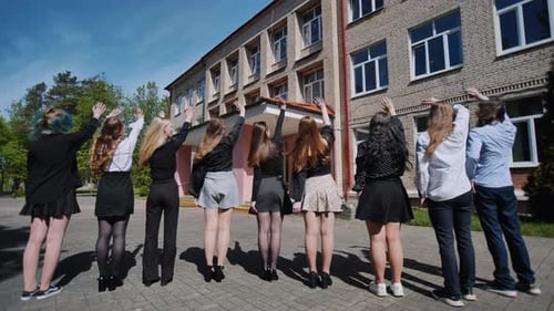 Happy Students Waving Goodbye on Their Last Day of School Celebrating the End of the Academic Year