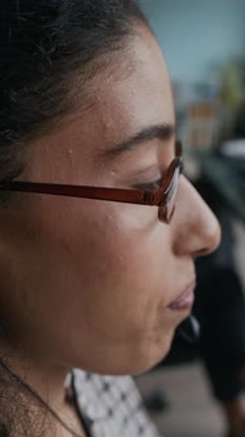 Female Manager of Call Center in Eyeglasses Speaking to Online Customer