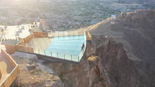 Aerial View Of Couple Enjoy A Scenery From The Glass Terrace