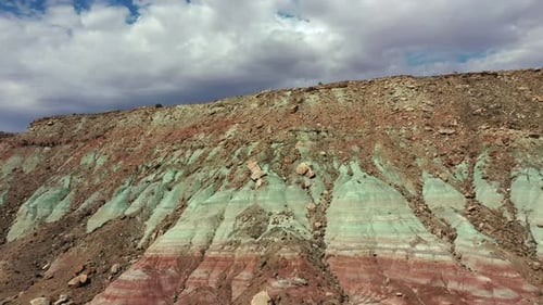 Colorful Layers Of Rock Formation Eroded On Desert Landscape In Utah. aerial pullback