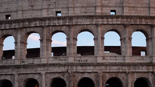 Detailed outside view of the Colosseum at sunset, Rome, Italy.
