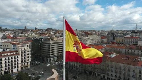 Waving Spain Flag on Spanish City