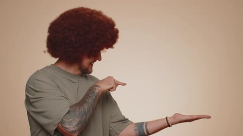 Man Pointing Empty Place Advertising Area for Commercial Text Copy Space for Goods Promotion