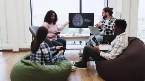 Woman Presenting Artificial Intelligence Concept to Team in Meeting