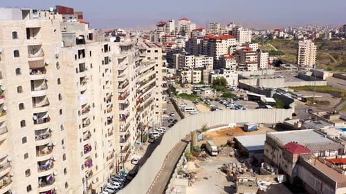 Security wall with Israeli idf watch tower Close to Shuafat Refugee Camp- Aerial