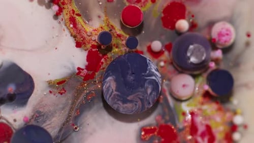 Fluid Art: Colorful Paint Bubbles Moving in Liquid