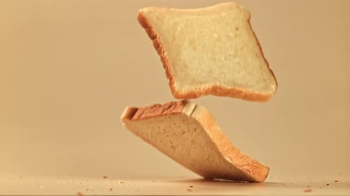 Falling Slices of Bread Stack Together in Studio