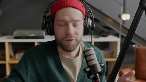 Male Podcast Host Talking in Studio Microphone as Recording Episode