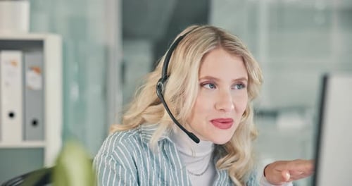 Woman with Headset Talking in a Call Center