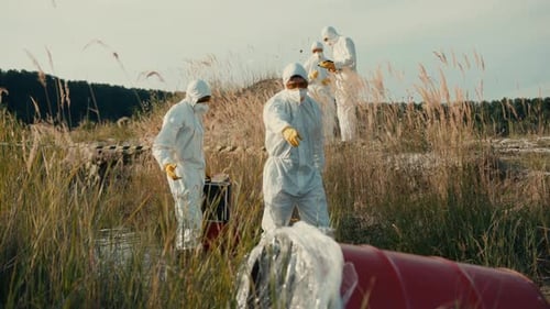 Team in protective suits inspects a chemical spill