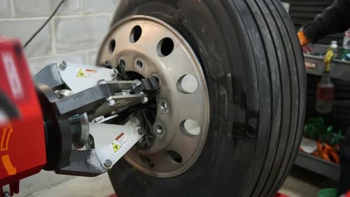 Wheel Balancing or Repair and Change Car Truck Tire at Auto Service Garage or Workshop By Mechanic
