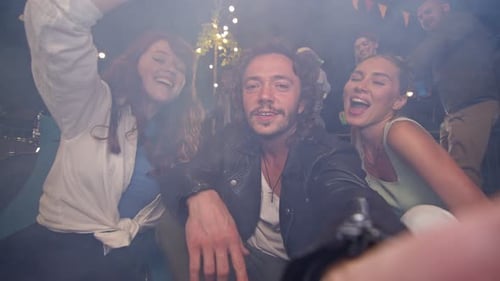 Smiling Friends Gather, Partying with Music at Night