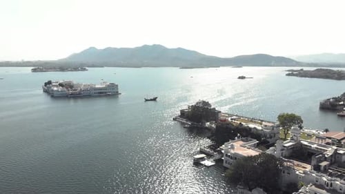 Panoramic view from Ambrai Ghat over Lake Pichola and Taj Lake Palace in Udaipur, Rajasthan, India -