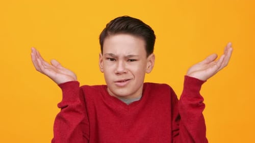 Teenage boy with a confused expression