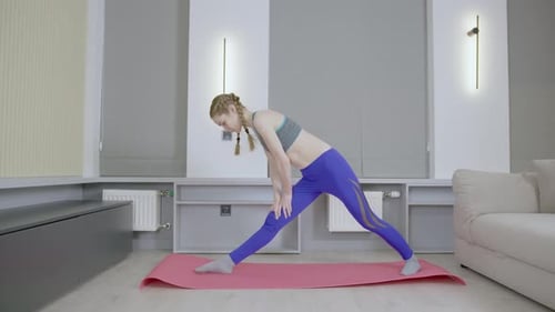 Young Woman Doing Yoga Poses at Home