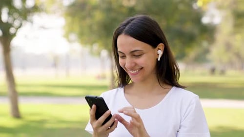 Indian woman setting up music before run