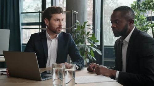 Two Diverse Businessmen Multiracial Men at Office with Laptop
